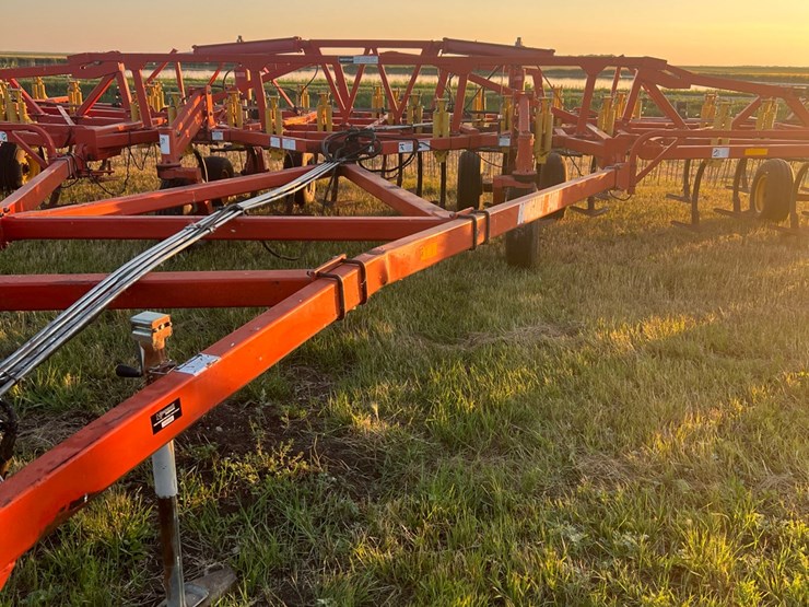 54’-bourgault-chisel,-12”-space,-heavy-harrows,-note:-hitch-slightly-bent-in-one-spot,-doesn’t-affect-performance-of-machine-as-hitch-is-floating.-image-8