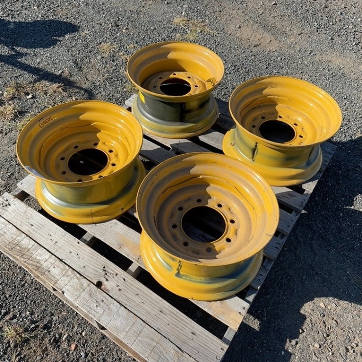 (4) STEEL SKID STEER WHEELS