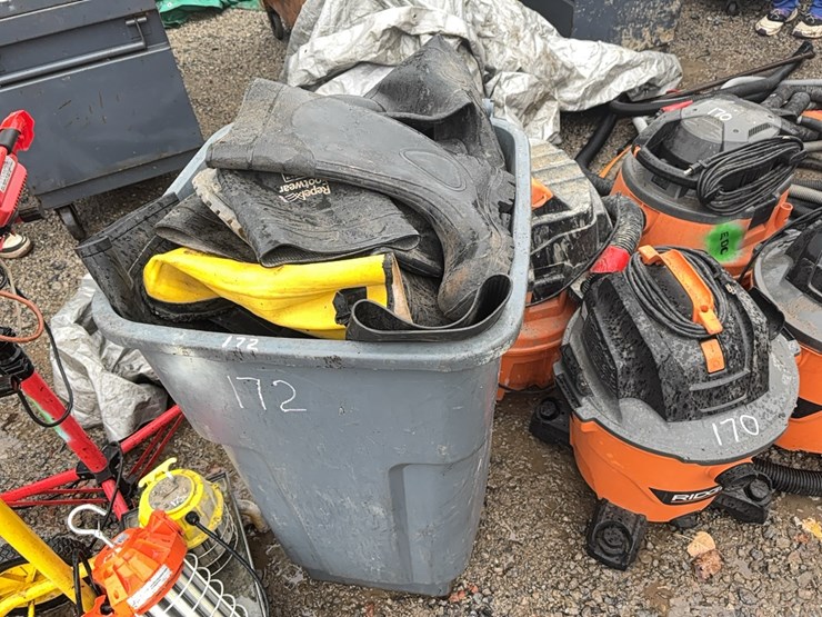 trash-barrel-full-of-rubber-boots-support-equipment-image-1