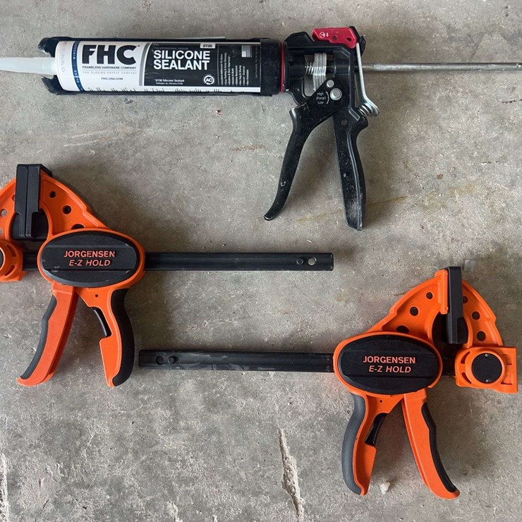 (2) Bar Clamps and 1 Caulk Gun