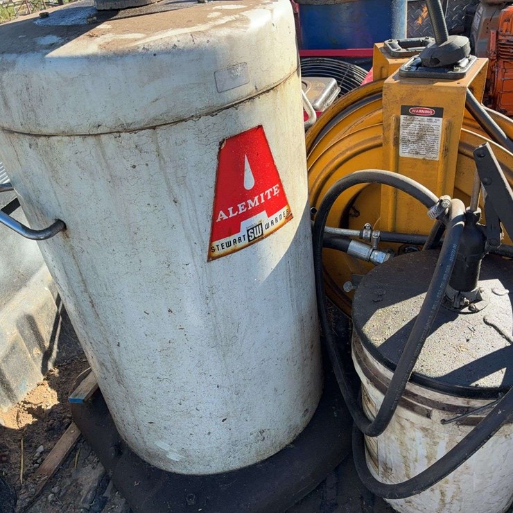 Oil and grease drums with pumps 2 rotary style fluid pumps 2 hose reels unknown condition