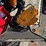 new-giyi-co-mini-stand-on-skidloader-rotating-grapple-image-2