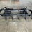#1428-•-unused-wolverine-skid-steer-brush-grapple-image-4