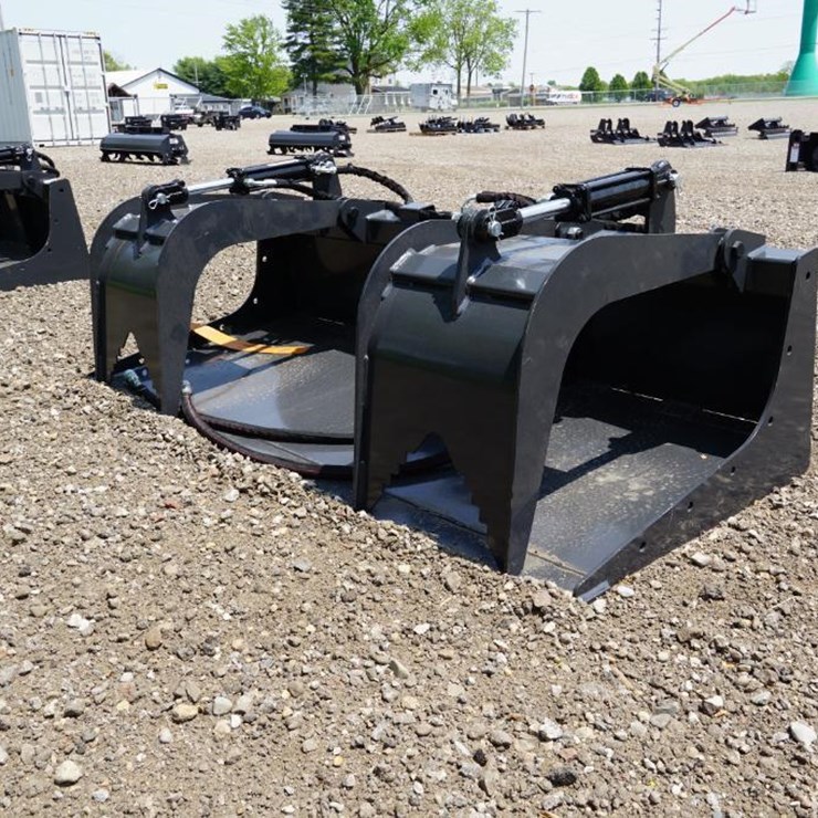 #1359 • New! Wolverine Skid Steer Grapple Bucket Attachment