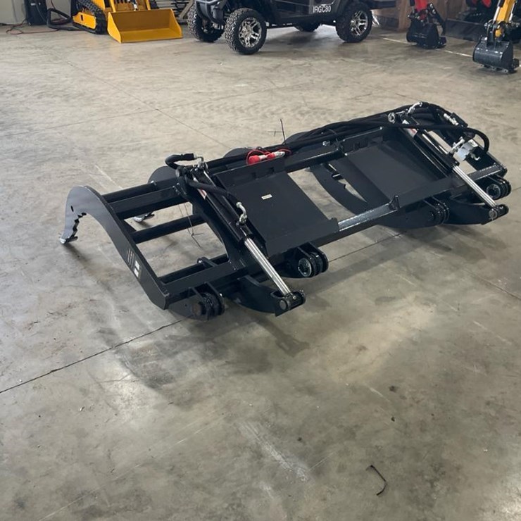 #1428 • Unused Wolverine Skid Steer Brush Grapple