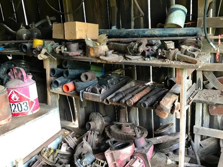 296 • Bush hog parts, seats, gas can, cotents of shelves and wall on