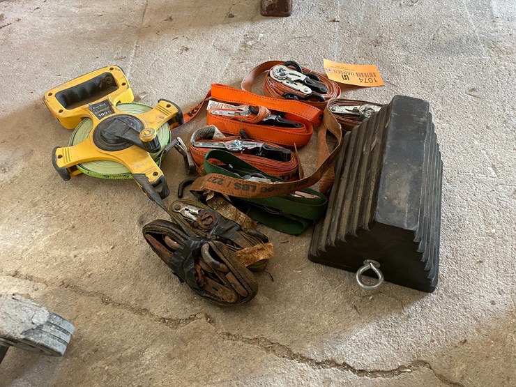 #1074-•-ratchet-straps,-100'-measuring-tape-and-wheel-chock-image-1