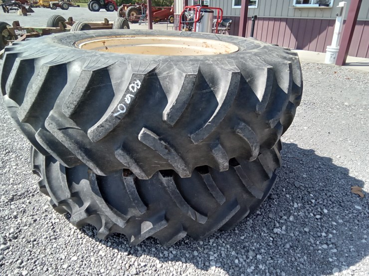 #869-•-titan-18.4-34-0n-9-bolt-rims-image-1