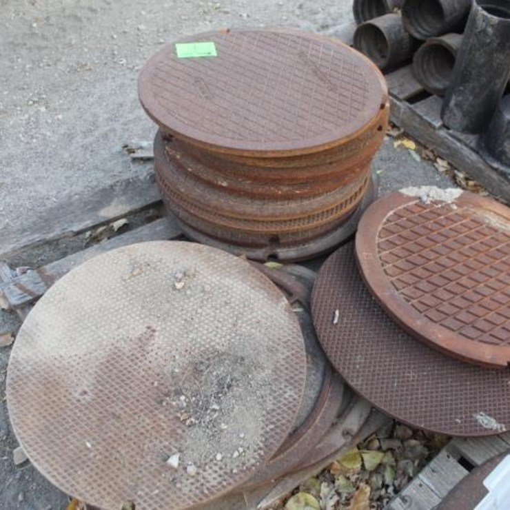 Pallet of 16 Man Hole Covers, +/- 2 Ft.