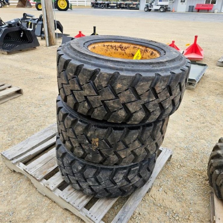#3082 • (3) 12-16.5 Tires & Rims