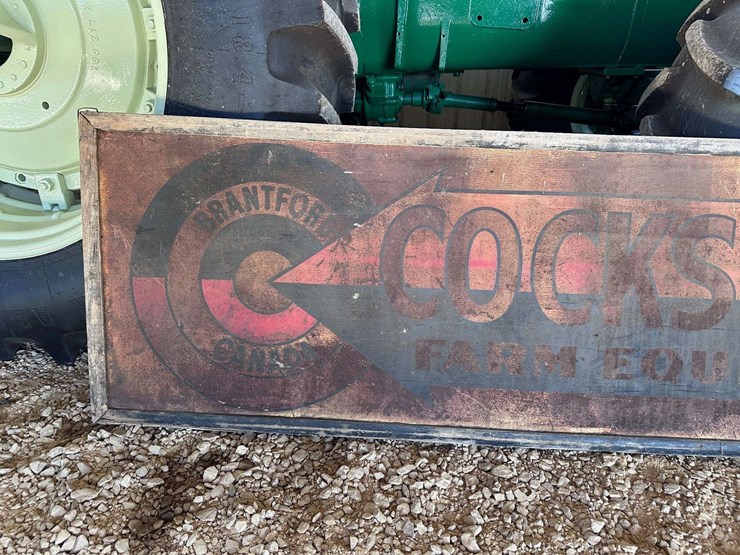 cockshutt-farm-equipment-metal-sign-with-wood-frame-image-2