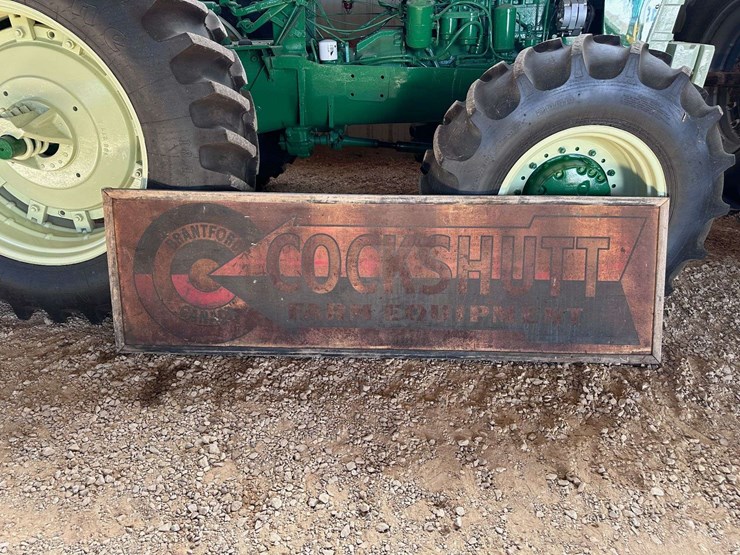 cockshutt-farm-equipment-metal-sign-with-wood-frame-image-1