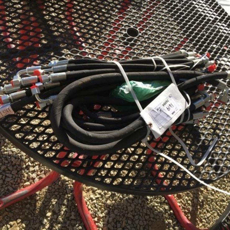 Bundle of Unused Hydraulic Hoses.