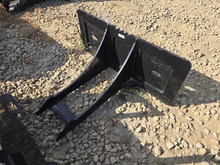 #5889-•-new-skid-steer-rock-digger-image-1