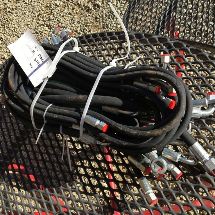 Bundle of Unused Hydraulic Hoses.