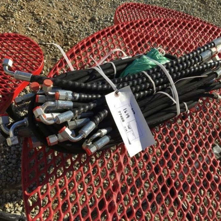 Bundle of Unused Hydraulic Hoses.