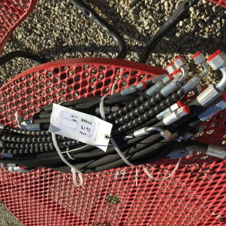 Bundle of Unused Hydraulic Hoses.