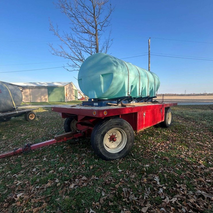 Unverferth flatbed wagon with 2,000 gal poly tank