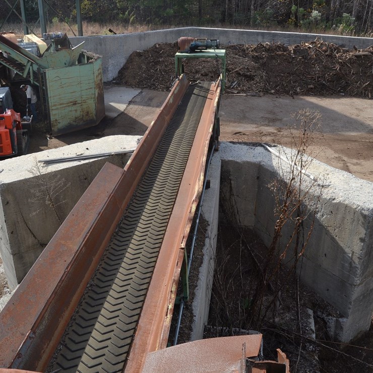 24"X60' BELT CONVEYOR W/ HEAVY DUTY ELECTRIC DRIVE LOCTED UNDER DEBARKER