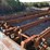 32'-4-strand-heavy-duty-infeed-log-deck-w/-#132-chain-w/-heavy-duty-drive-w/-steel-support-to-the-ground-image-2