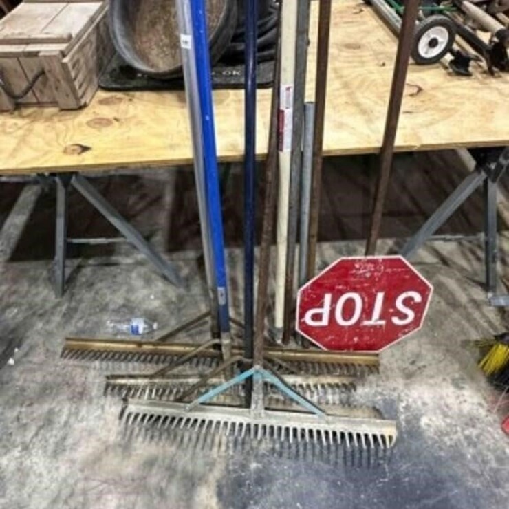 4 Metal rakes & stop sign