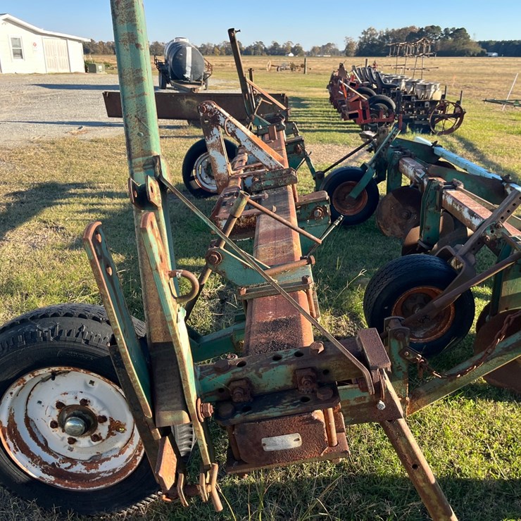 KMC 4 row ripper bedder, 196”x4”x7” bar, 196”x4”x4” bar, 1- 196”x2.5”x2.5” bar,  2 sets of gauge wheels, some row marker parts, located at 1244 Vandiford Thomas Rd., SnowHill, NC call 252-531-8061 for more info.