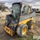 2013-deere-320e-image-1