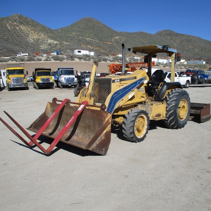 2004 DEERE 210LE