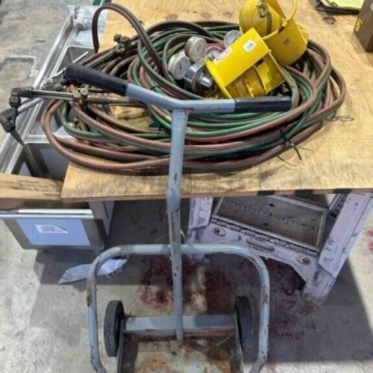 2 Torches, hose, safety caps, gauges, bottle cart