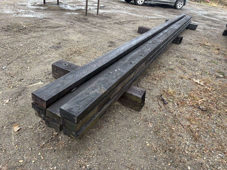 (8)-3”x6”-creosote-treated-beams,-(5)-are-approx-26’,-(3)-are-approx-28’,-at-farm-image-1