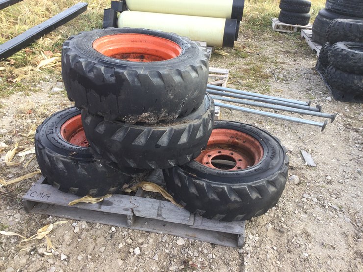 #4559-•-(4)-skid-steer-tires-and-wheels-image-1