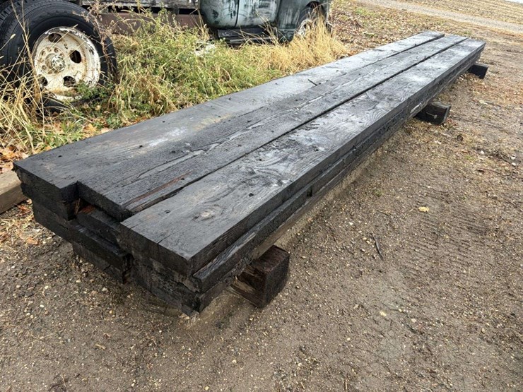 (12)-3x12”x26’-approx-creosote-treated-beams,-at-farm-image-1
