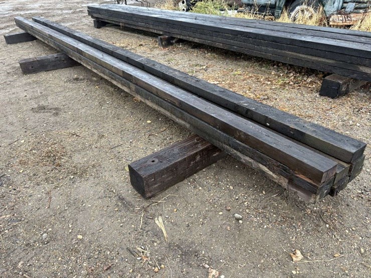 (8)-3”x6”-creosote-treated-beams,-(5)-are-approx-26’,-(3)-are-approx-28’,-at-farm-image-3