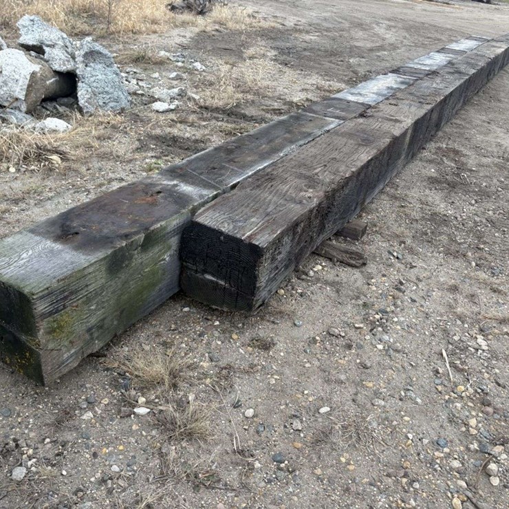 (2) Creosote Treated Wood Beams, (1) is 14”x14”x 38’ approx, (1) is 13”x14”x 32’ approx, F