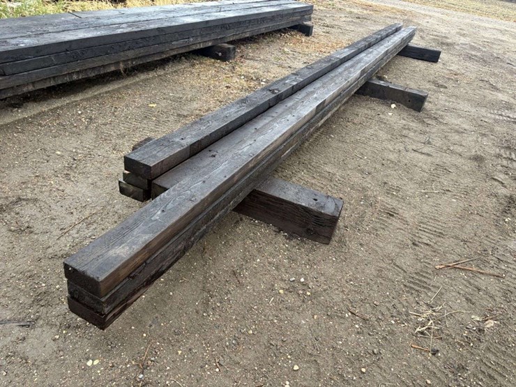 (8)-3”x6”-creosote-treated-beams,-(5)-are-approx-26’,-(3)-are-approx-28’,-at-farm-image-4