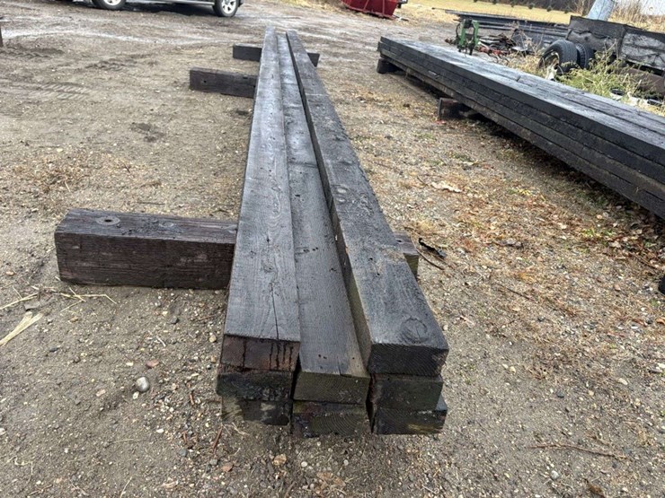 (8)-3”x6”-creosote-treated-beams,-(5)-are-approx-26’,-(3)-are-approx-28’,-at-farm-image-2