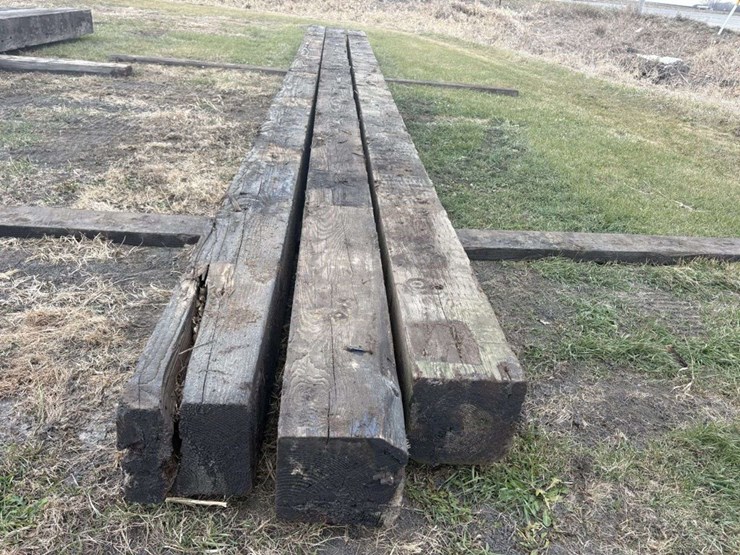 (3)-12”x12”-creosote-treated-wood-beams,-(2)-are-approx-34’,-(1)-is-approx-32’,-c-image-3