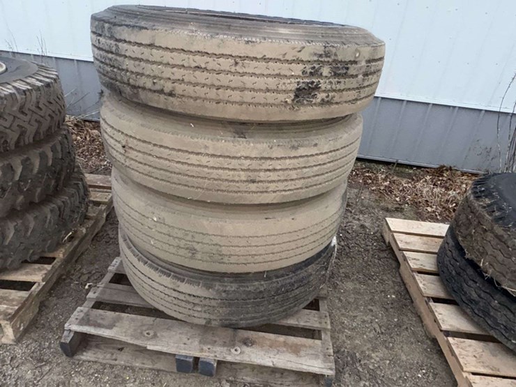 (4)-firestone-10.00r20-truck-tires-on-dayton-rims-image-1