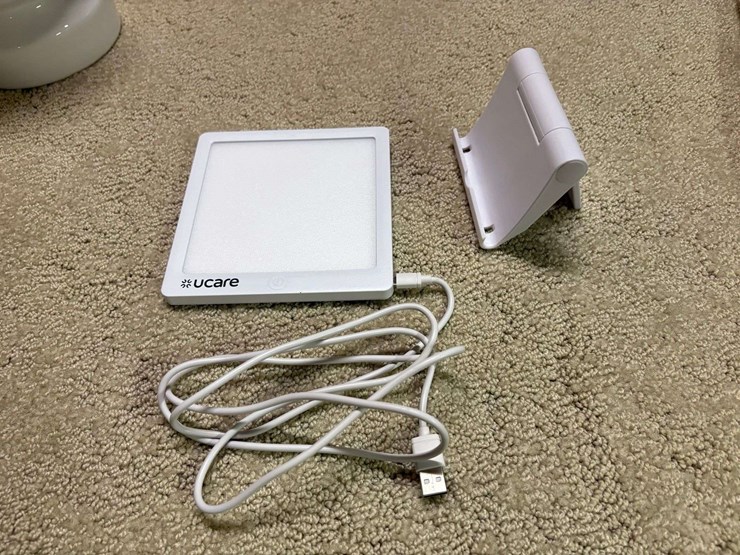 miscellaneous-lot:-igloo-water-cooler,-solar-led-umbrella-lights,-ucare-happy-light,-tom-tom-gps,-co-image-2