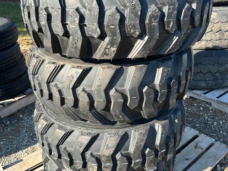 (4)-unused-10-16.5-tires-on-bobcat-wheels-image-1