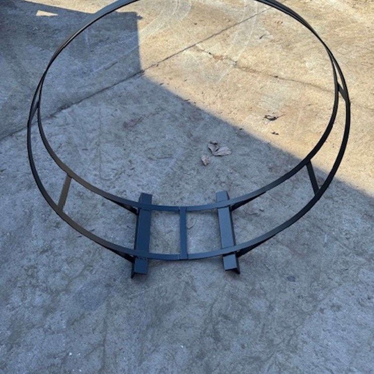 UNUSED IRON FIREWOOD HOLDER