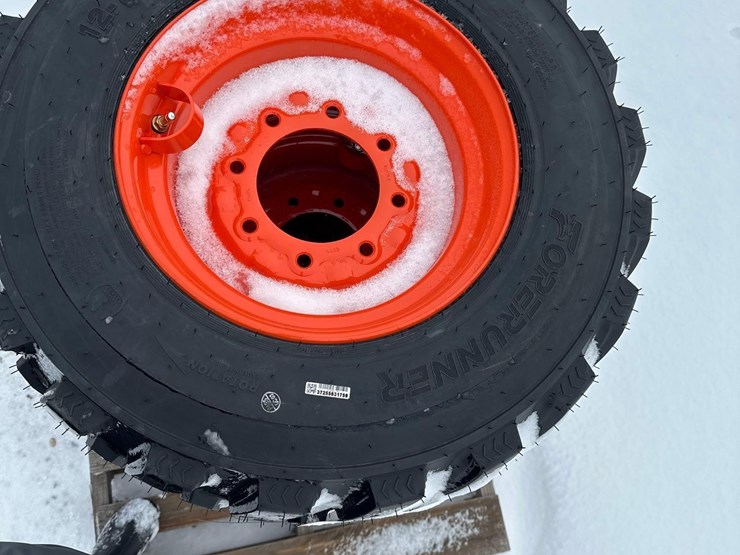 2717---(4)---new-12x16.5-nhs-tires-on-bobcat-style-8-lug-rims-image-2