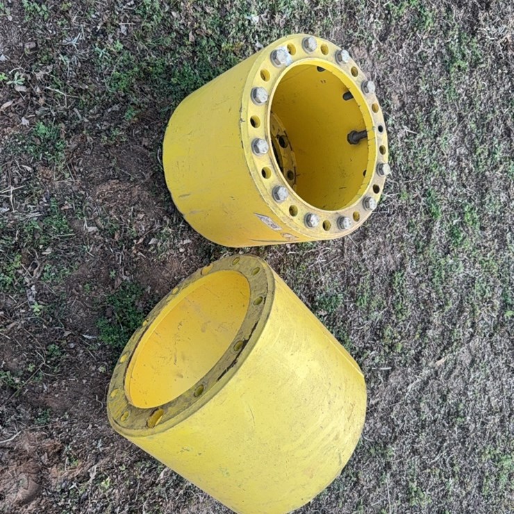 Unverferth 12 bolt front wheel spacers ￼ measuring approximately 16 inches outside the outside