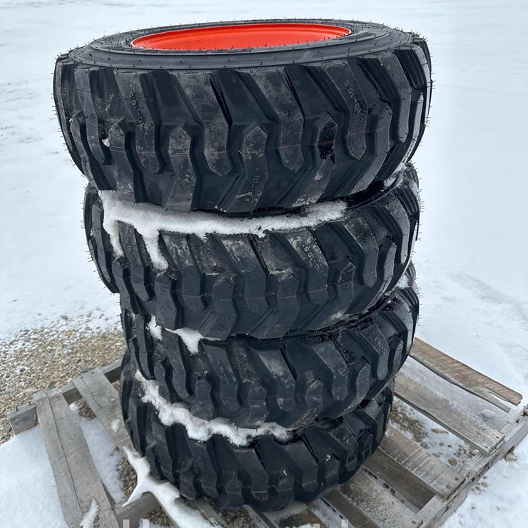 2722 - (4) - NEW 10x16.5 NHS ON BOBCAT STYLE 8 LUG RIMS