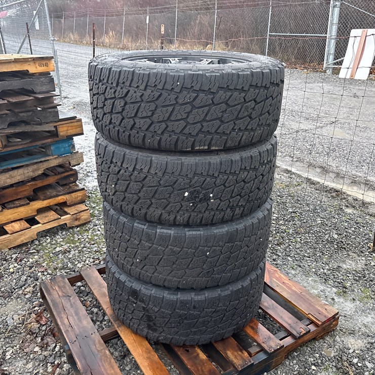 #6512 • E1. (4) Nitto LT285/55R20 tires on rims