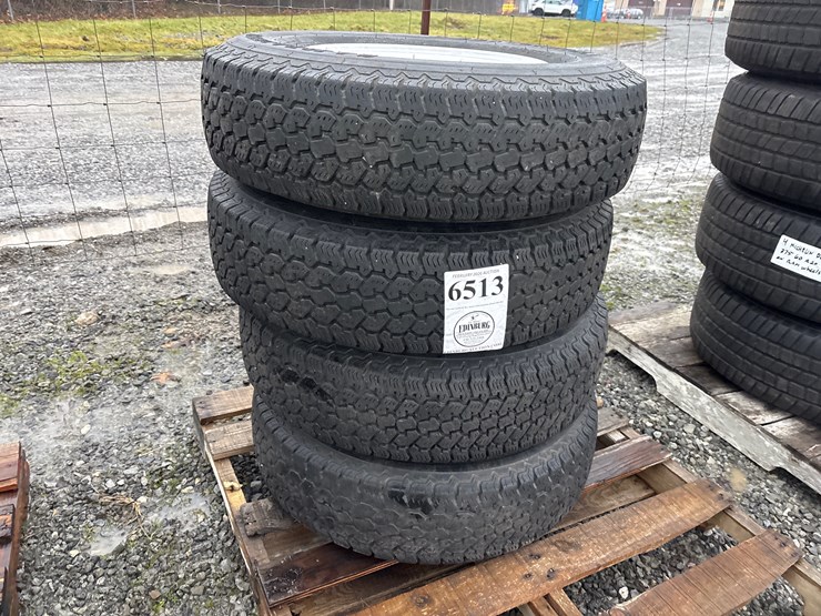 #6513-•-e1.-(4)-campaigner-centennial-lt-235/85r16-tires-on-rims-image-1