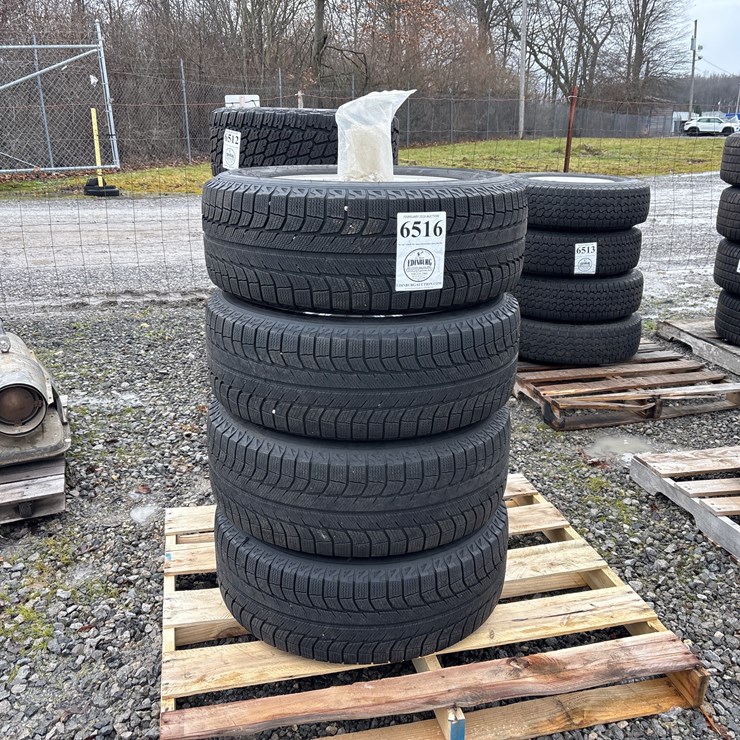 #6516 • E1. (4) michelin 265/60 R18 tires on rims