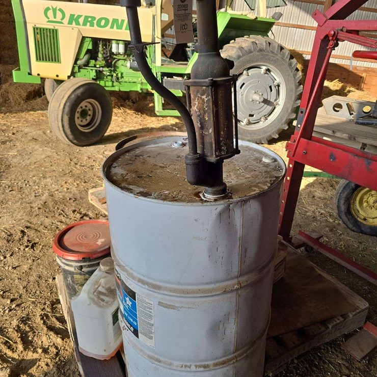 2 oil barrels one with hand pump