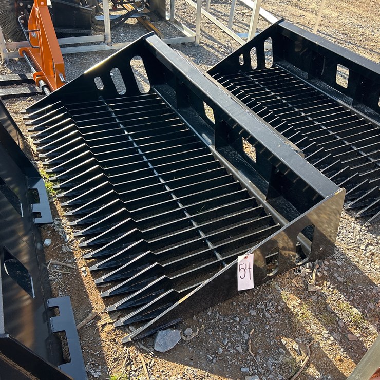 #54 • UNUSED 68” SKID STEER ROCK BUCKET