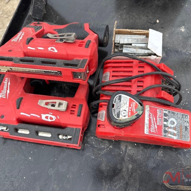 (2) MILWAUKEE CORDLESS STAPLE GUNS W/ BATTERIES & CHARGER
